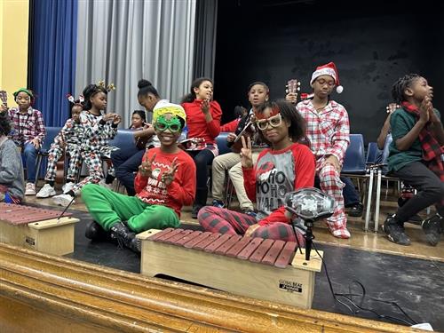 students takin picture at music program
