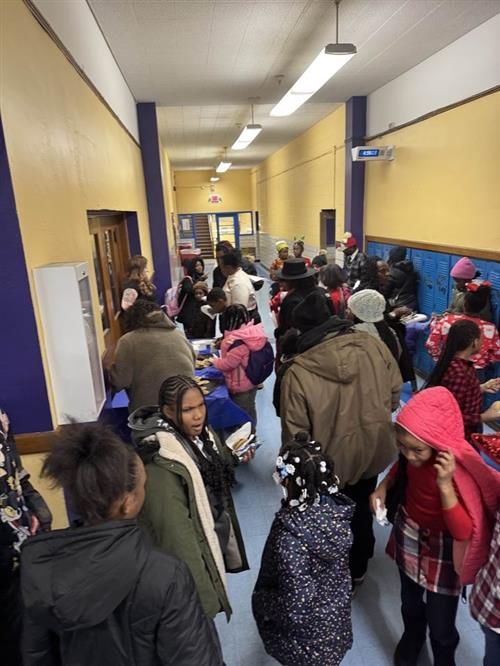 students and parents getting refreshments at Christmas program