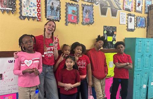 teacher with group of students smiling