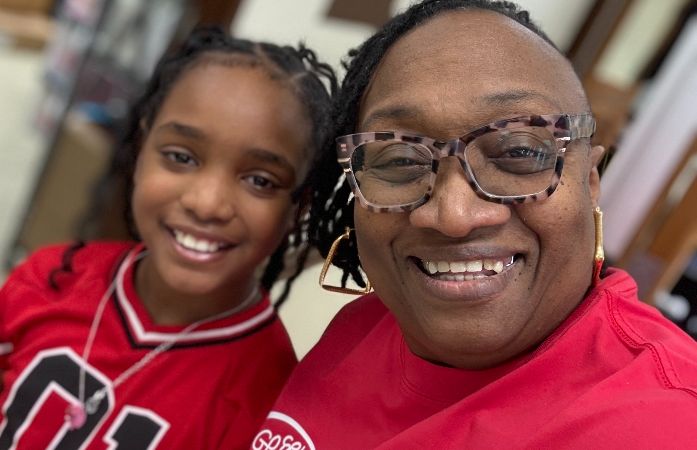  assistant principal and student smiling