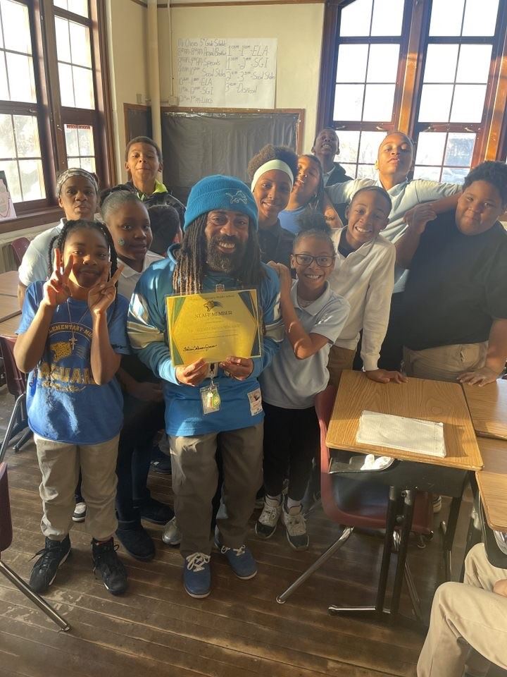 Teacher with students taking a picture