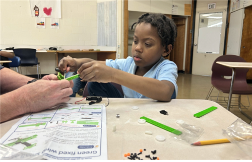  Male student working on a Lego Stem Activies