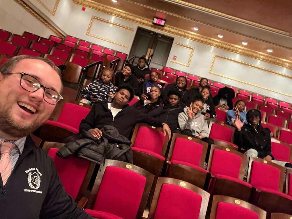  students and teacher at the symphony