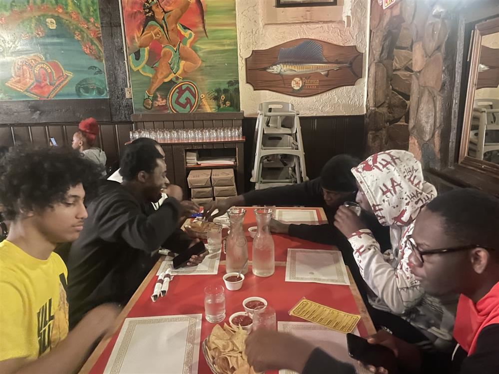  students eating Mexican food 