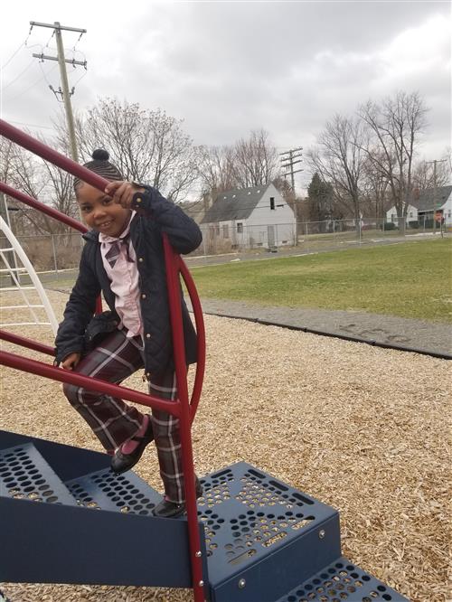 Child walking on playscape 