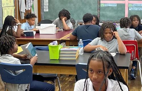 students reading a book