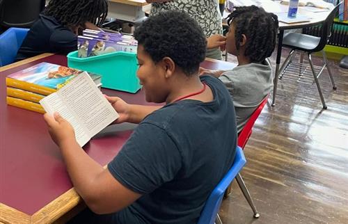 students reading a book