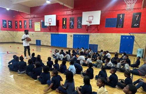 boys listening and raising their hand during mentoring session