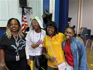  Student and teachers posing for a picture