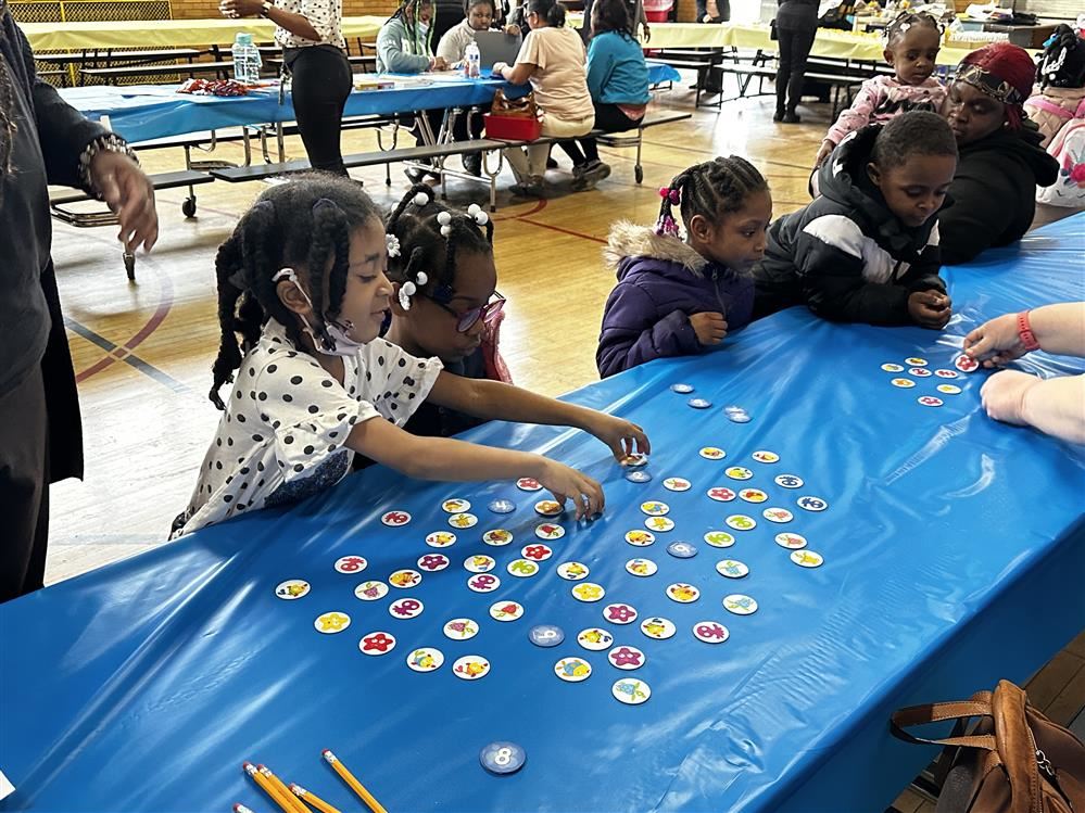  Students sitting at a table counting