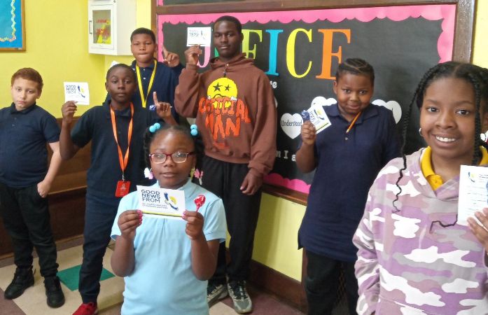  Students holding gift cards