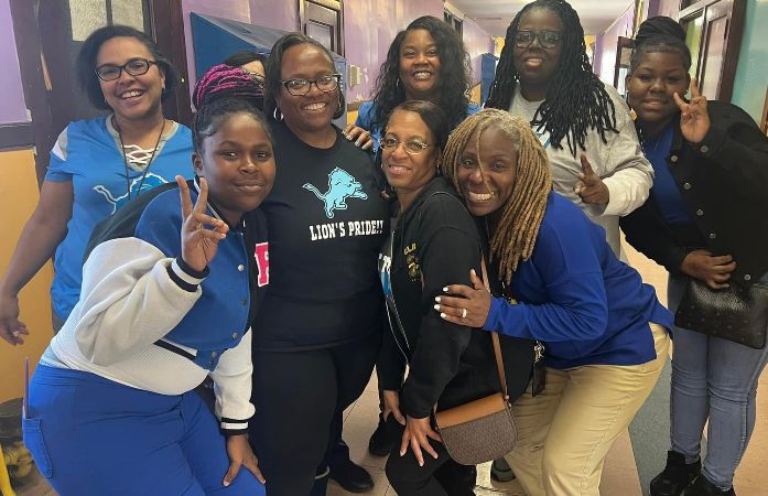Staff and students wearing Honolulu Blue.