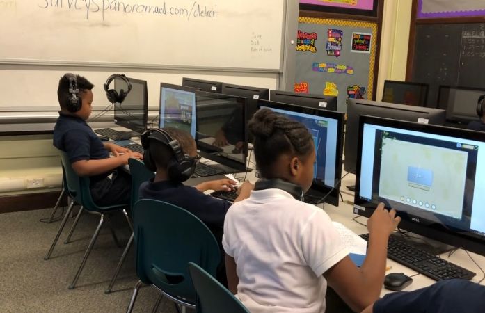  Students sitting in a computer lab.