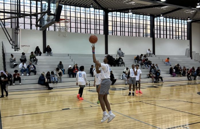  Student shooting basketball