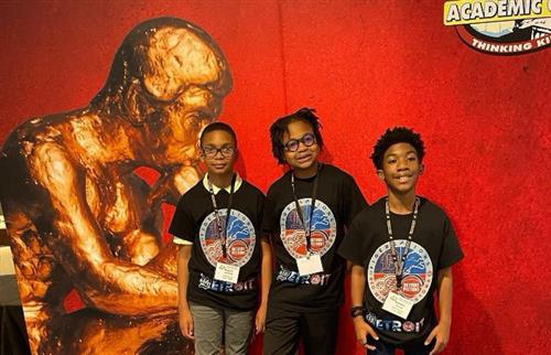 Three Chrysler students (now at Bunche) smiling at the 2024 National Tournament