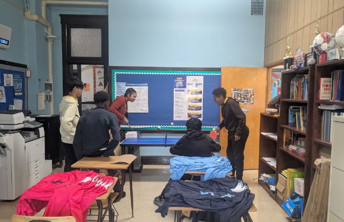  Teacher and student playing ping pong