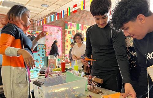 students at PBIS store buying items