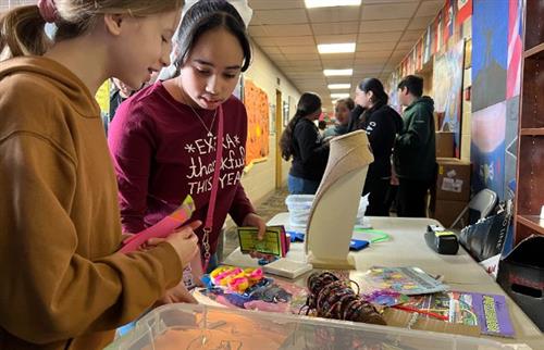 Students looking at the Store items