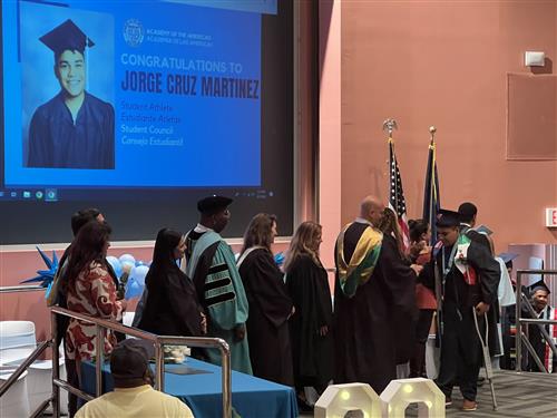 student walking on stage