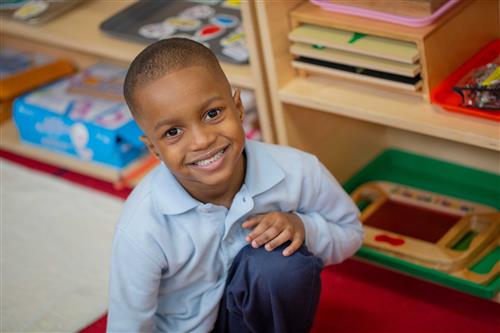 Young boy kneeling 