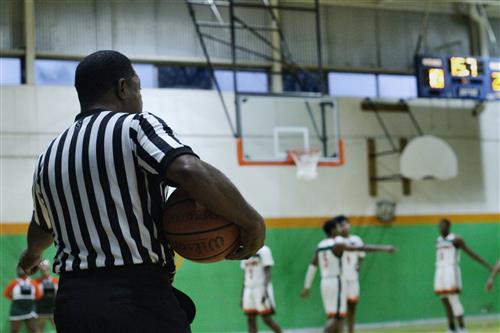 Referee at varsity basketball game 
