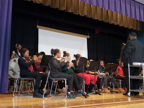 Band members playing Amazing Grace 