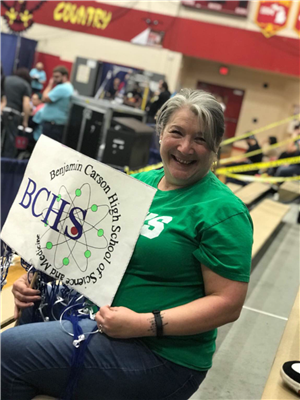 Mrs. Schwendemann cheering on the team at competition Mrs. Schwendemann cheering on the team at competition