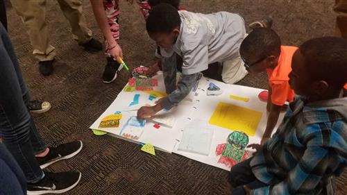 Second grade students present their pop up book at the Destination Imagination tournament 