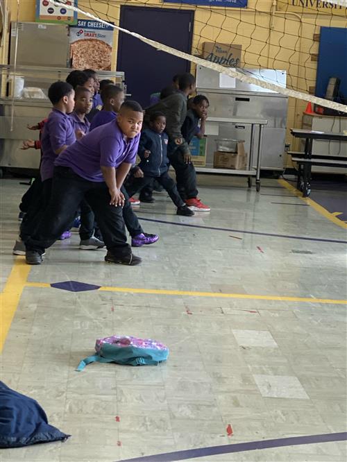 Students actively participating in gym activities.
