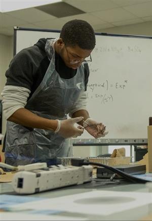 student working on experiment
