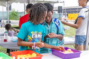 Students playing with kinetic sand
