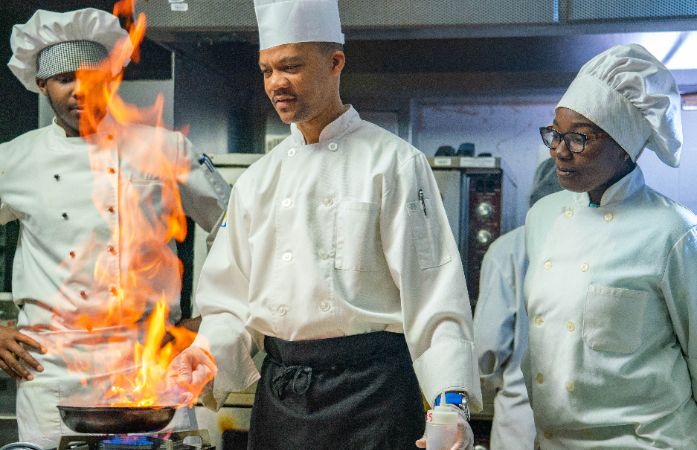  Teacher demonstrating cooking for students