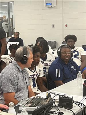 coaches and students talking