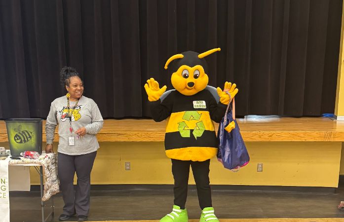  a giant bee with a female teacher