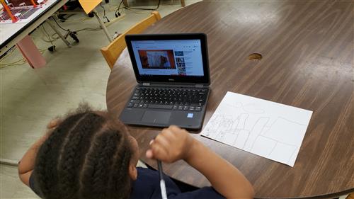 Student using computer for drawing 