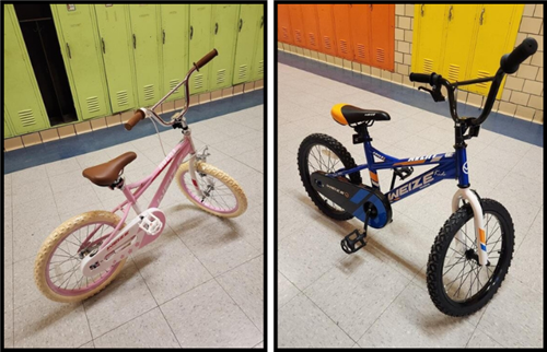 a pink and blue bike in the hallway