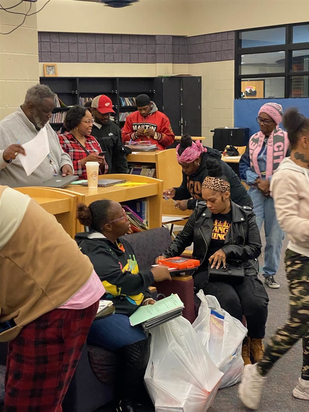  a group of parents socializing at a school event