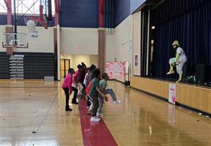 students dancing with a DJ
