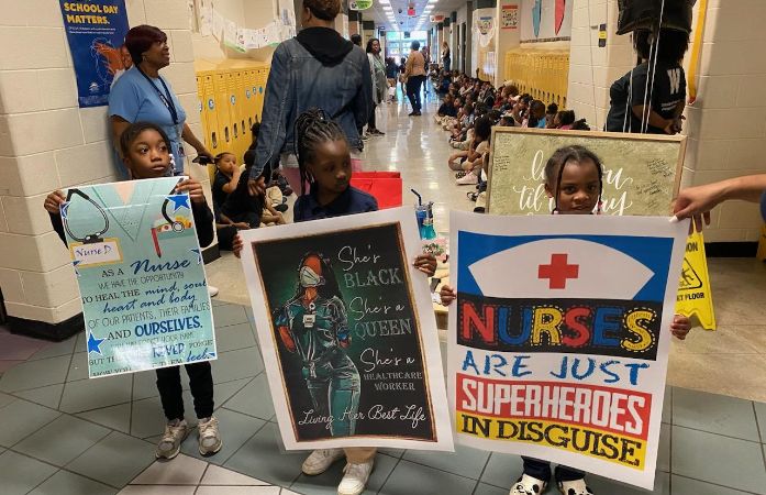 students celebrating our nurse
