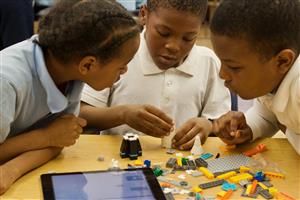  Students building with lego's