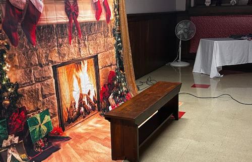 Fireplace backdrop with bench in front. Waiting for Santa to arrive.