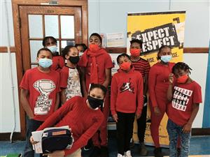 Student take a picture wearing Red