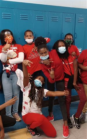 Student take a picture wearing Red