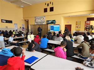 Students listen to speaker