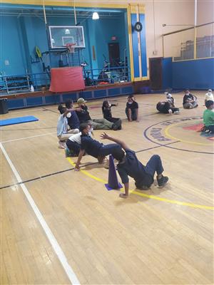 Students and officers play Duck, Duck Goose