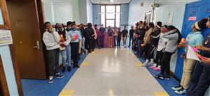 Middle schoolers wait to enter the PBIS store