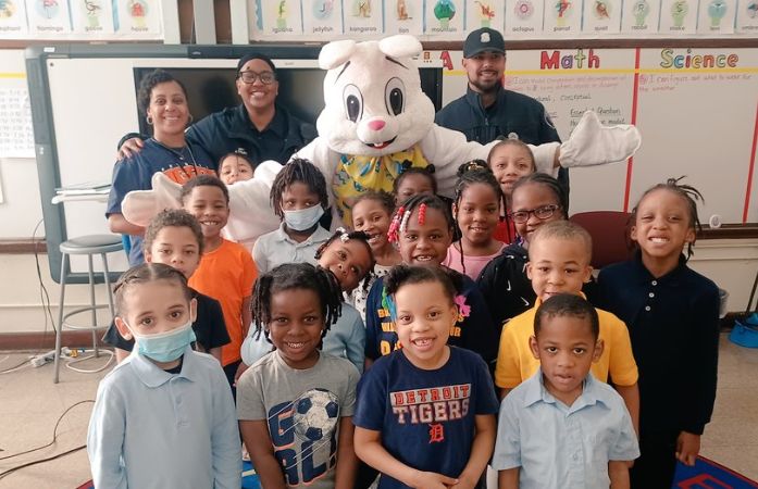 Easter bunny take pictures with students