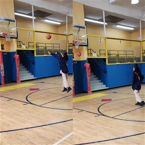 Female students shoots a basketball