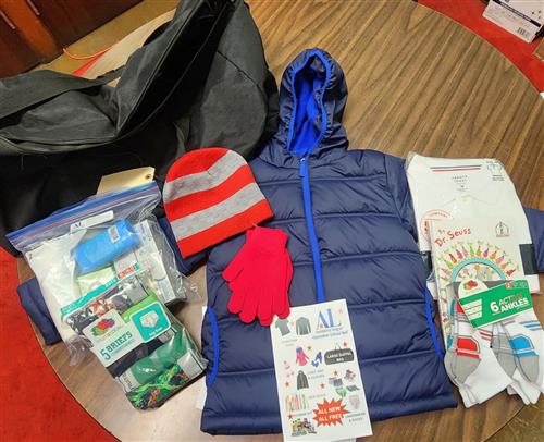 Coat, hat, and gloves  Large duffle bag 2 uniform shirt  Hygiene kit Socks & underwear