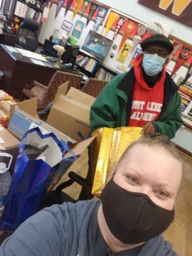 Burns Dean and Teacher Ms. Gray pack PBIS prizes 